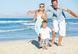 Happy family on tropical beach