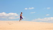 girl runs on sand