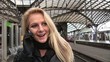 Video: Business woman on the phone on central station outside Business woman on the phone on central station outside