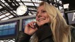 Video: Business woman on the phone on central station outside Business woman on the phone on central station outside