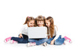 Photo: Three attractive girl using a laptop Three attractive girl using a laptop