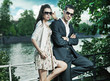 Young, smiling couple wearing sunglasses