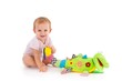 Photo: Happy toddler playing with toy Happy toddler playing with toy