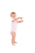 Photo: Adorable baby girl making first steps Adorable baby girl making first steps