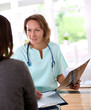 Foto: Nurse with patient in check-up room Nurse with patient in check-up room