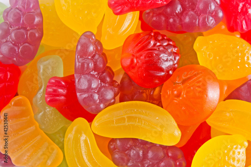 Photo: fruit gummy candies background fruit gummy candies background