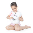 Little girl doctor with white teddy bear