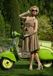 Woman in retro dress with a scooter