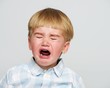 Foto: Crying baby boy in checkered shirt Crying baby boy in checkered shirt