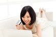 Photo: Beautiful young woman using a laptop computer. Portrait of asian Beautiful young woman using a laptop computer. Portrait of asian