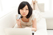 Beautiful young woman using a laptop computer. Portrait of asian
