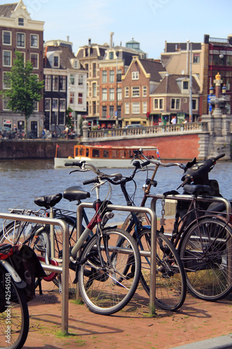 Photo: Amsterdam canals , bicycle and typical houses , Netherlands Amsterdam canals , bicycle and typical houses , Netherlands