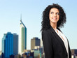 Young businesswoman with skycrapers in the background