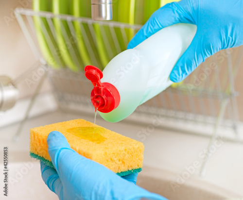 Photo: Dishwashing Liquid and Sponge. Dish Washing Dishwashing Liquid and Sponge. Dish Washing