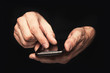 Man typing a text message on a smartphone