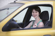 Photo: Happy woman in her car with glasses Happy woman in her car with glasses