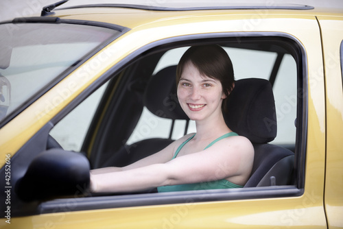 Photo: Happy woman in her new car Happy woman in her new car