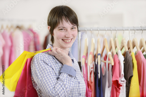 Photo: woman shopping for clothes woman shopping for clothes