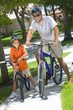 African American Man & Boy, Father and Son Riding Bikes