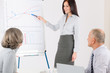 Giving presentation young woman during meeting