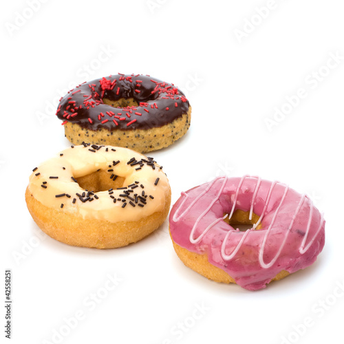 Photo: Delicious doughnuts isolated on white background Delicious doughnuts isolated on white background