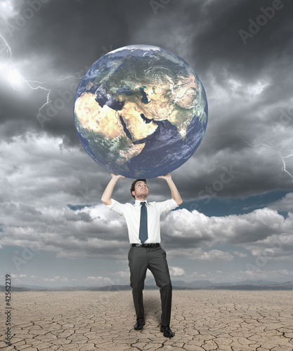 Foto: Businessman protects the world Businessman protects the world
