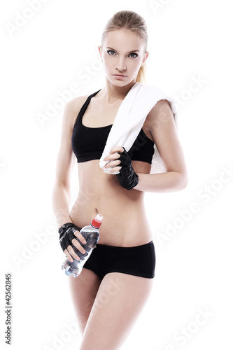 Photo: Beautiful girl with towel and bottle of water Beautiful girl with towel and bottle of water