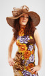 Photo: Pretty girl in a summer dress and a broad-brim Pretty girl in a summer dress and a broad-brim