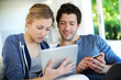 Happy young couple doing shopping on internet