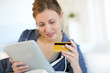 Closeup of beautiful blond girl doing online shopping