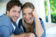 Closeup of cheerful young couple wearing blue