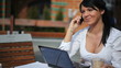 Beautiful woman talking on the phone in cafe