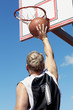 Foto: Basketball player throws ball in the basket Basketball player throws ball in the basket