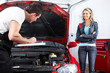 Professional auto mechanic and  a client.