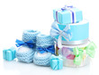 beautiful gifts and baby's bootees isolated on white