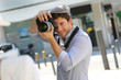 Photographer taking picture of woman model