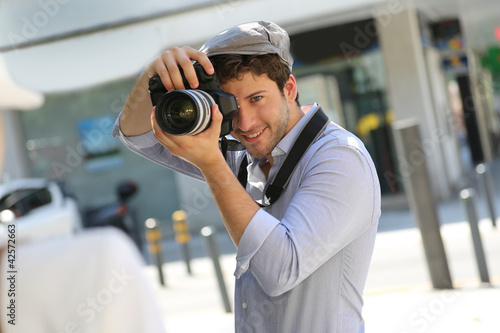 Photo: Photographer taking picture of woman model Photographer taking picture of woman model