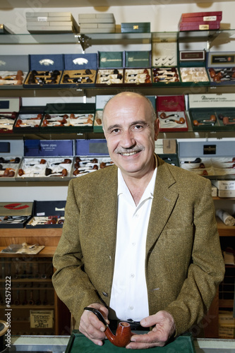 Photo: Portrait of a mature tobacco shop owner Portrait of a mature tobacco shop owner