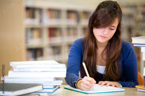 Photo: Woman studying at the library Woman studying at the library