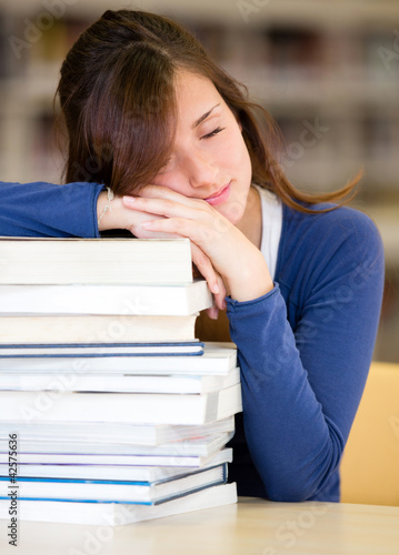 Photo: Student sleeping in the library Student sleeping in the library