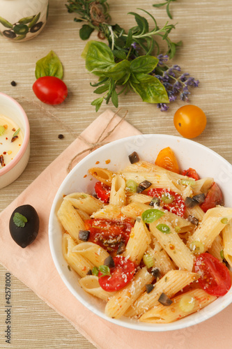 Photo: Penne pasta with cherry tomatoes and basil Penne pasta with cherry tomatoes and basil