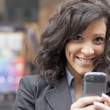 Young Woman with cell phone walking