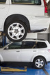 Car on hoist in automobile repair shop