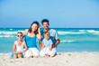 Foto: Family having fun on tropical beach Family having fun on tropical beach