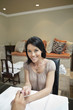 Photo: Portrait of a happy mid adult woman getting nails polished by manicurist in beauty salon Portrait of a happy mid adult woman getting nails polished by manicurist in beauty salon