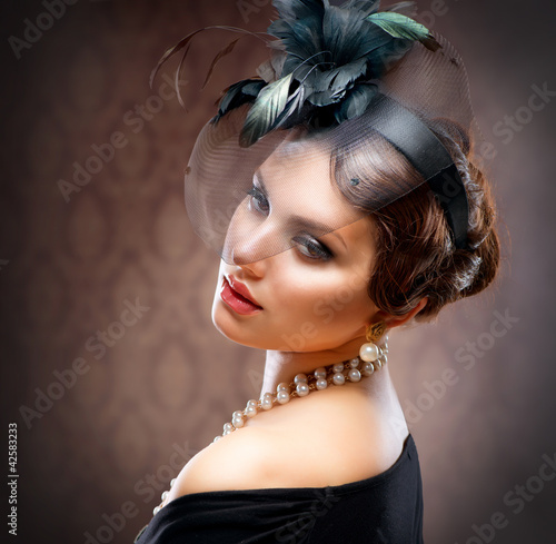 Photo: Retro Beauty Portrait. Vintage Styled. Beautiful Young Woman Retro Beauty Portrait. Vintage Styled. Beautiful Young Woman
