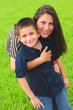 Beautiful mom hugging son