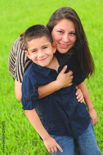 Photo: Beautiful mom hugging son Beautiful mom hugging son