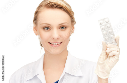Photo: attractive female doctor with pills attractive female doctor with pills