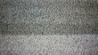 Static noise of flickering detuned TV screen